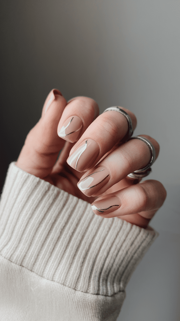 Subtle Metallic Swirls on Short Nude Nails